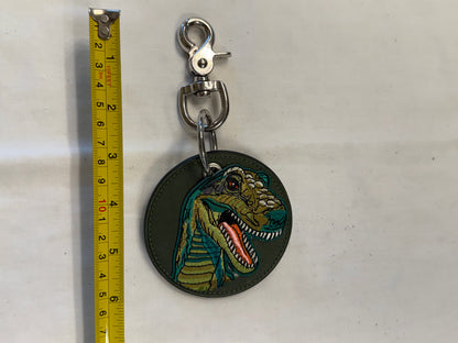 One-of-a-Kind Upcrafted Coach Coaster Bag Charm | Olive Leather with T-Rex Patch