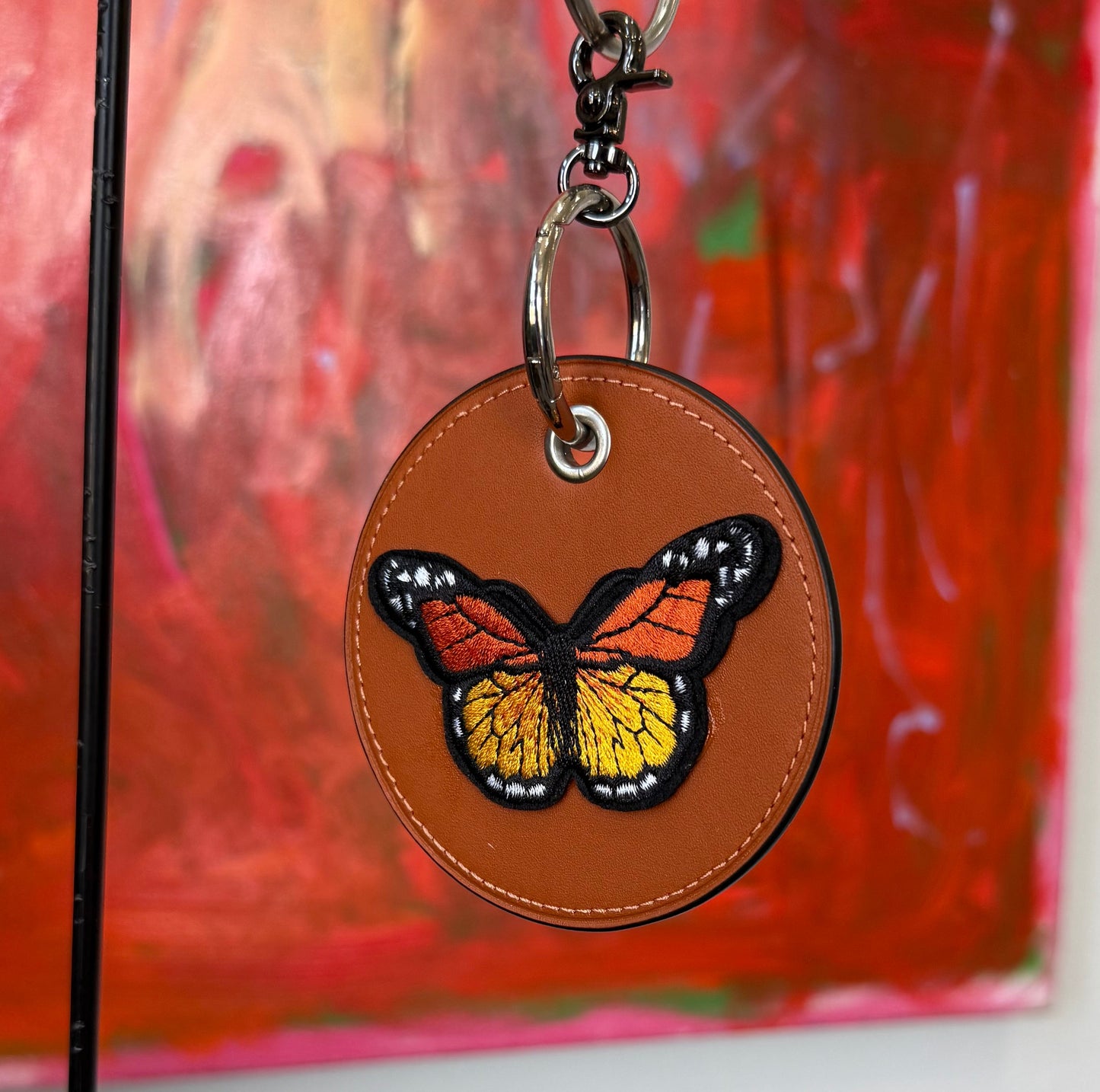 One-of-a-Kind Upcrafted Coach Coaster Bag Charm | Orange Leather with Orange & Red Butterfly Patch