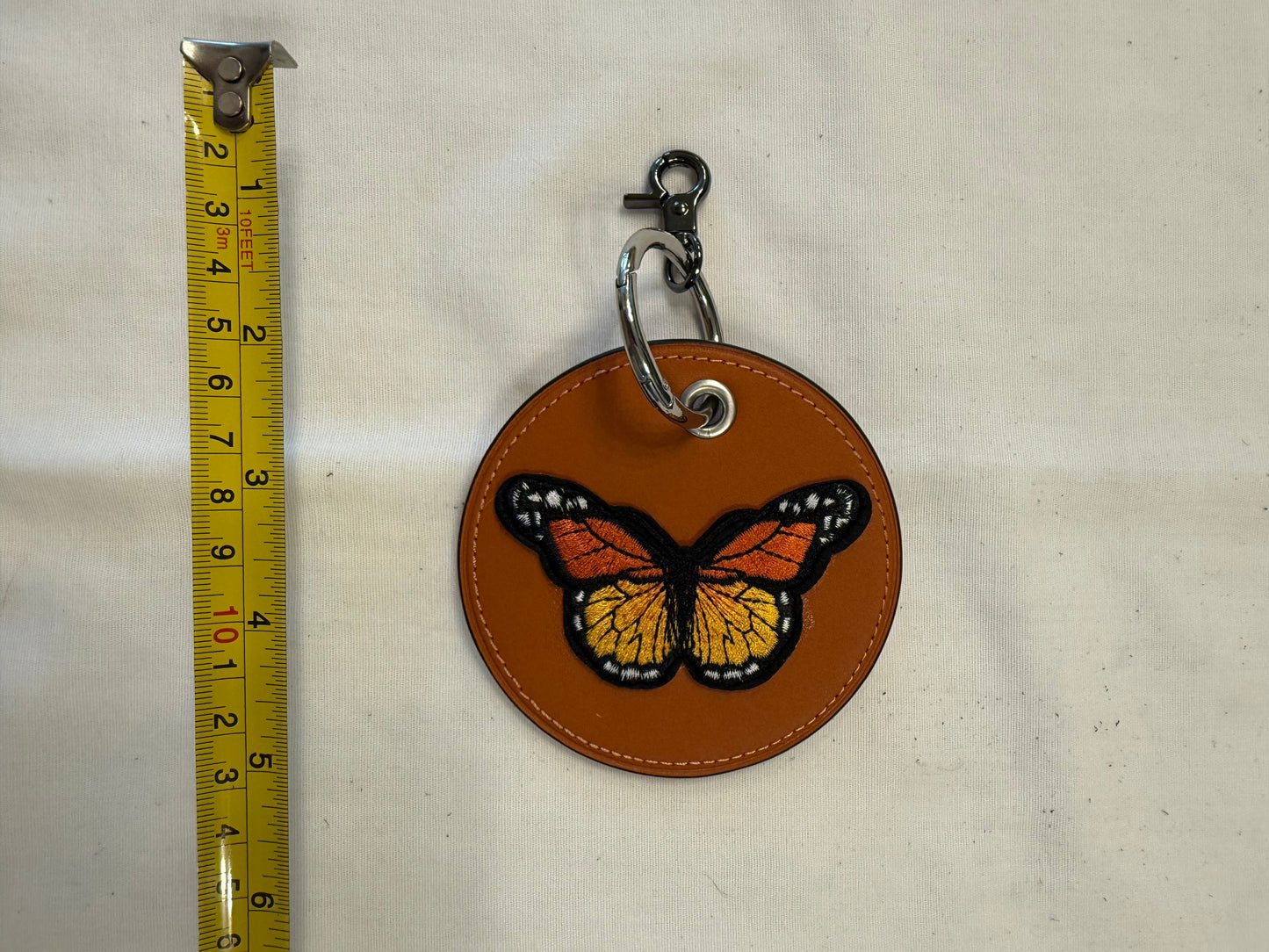 One-of-a-Kind Upcrafted Coach Coaster Bag Charm | Orange Leather with Orange & Red Butterfly Patch