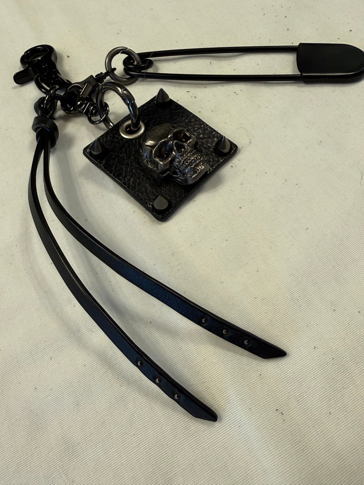 Upcrafted Bag Charm Cluster | Repurposed Leather Cord/Tassel, Skull Charm & XL Safety Pin