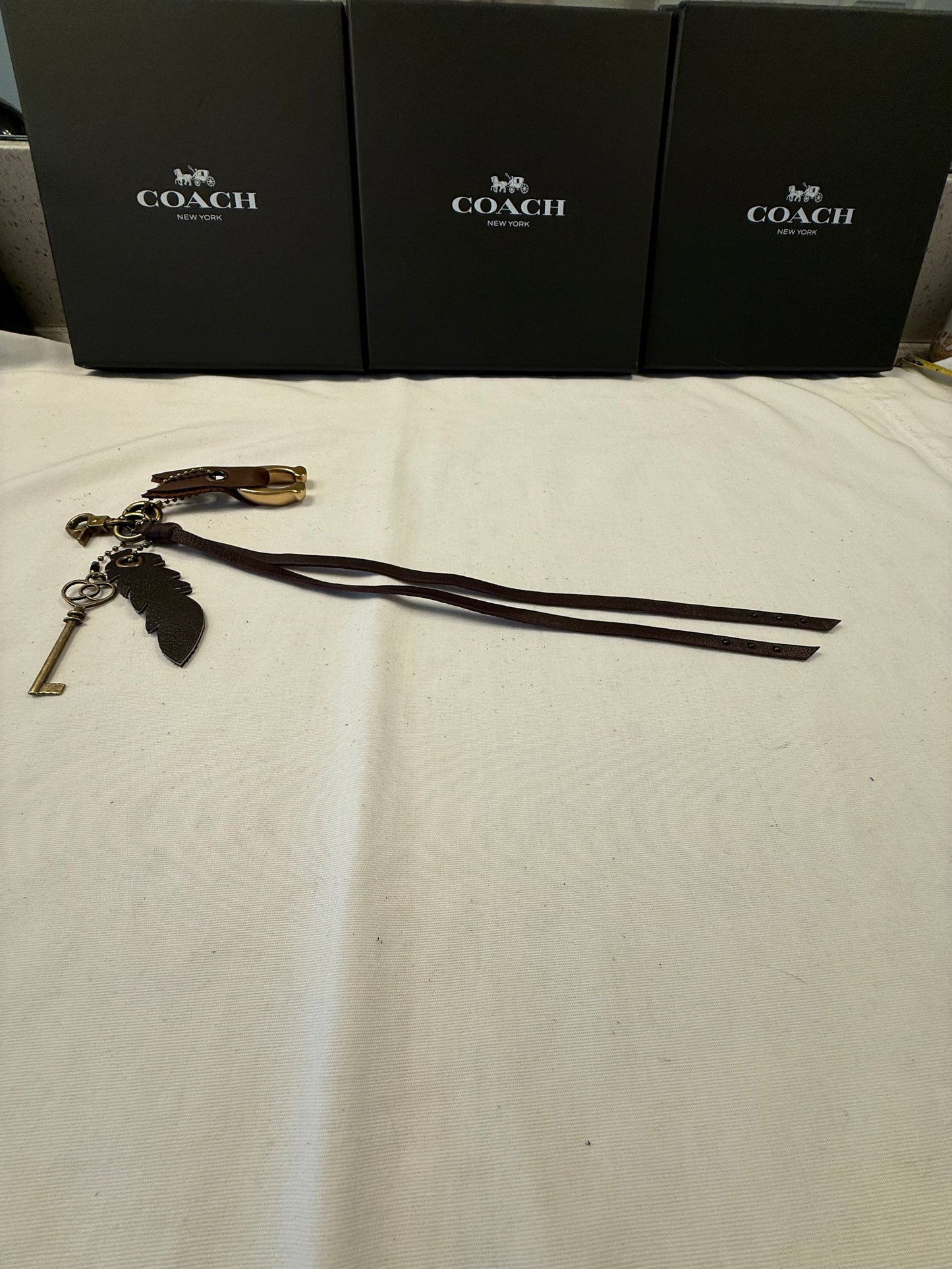 Upcrafted Bag Charm Cluster | Repurposed Coach Leather Tassel, Tic Tac Toe "C", Key & Leather Feather