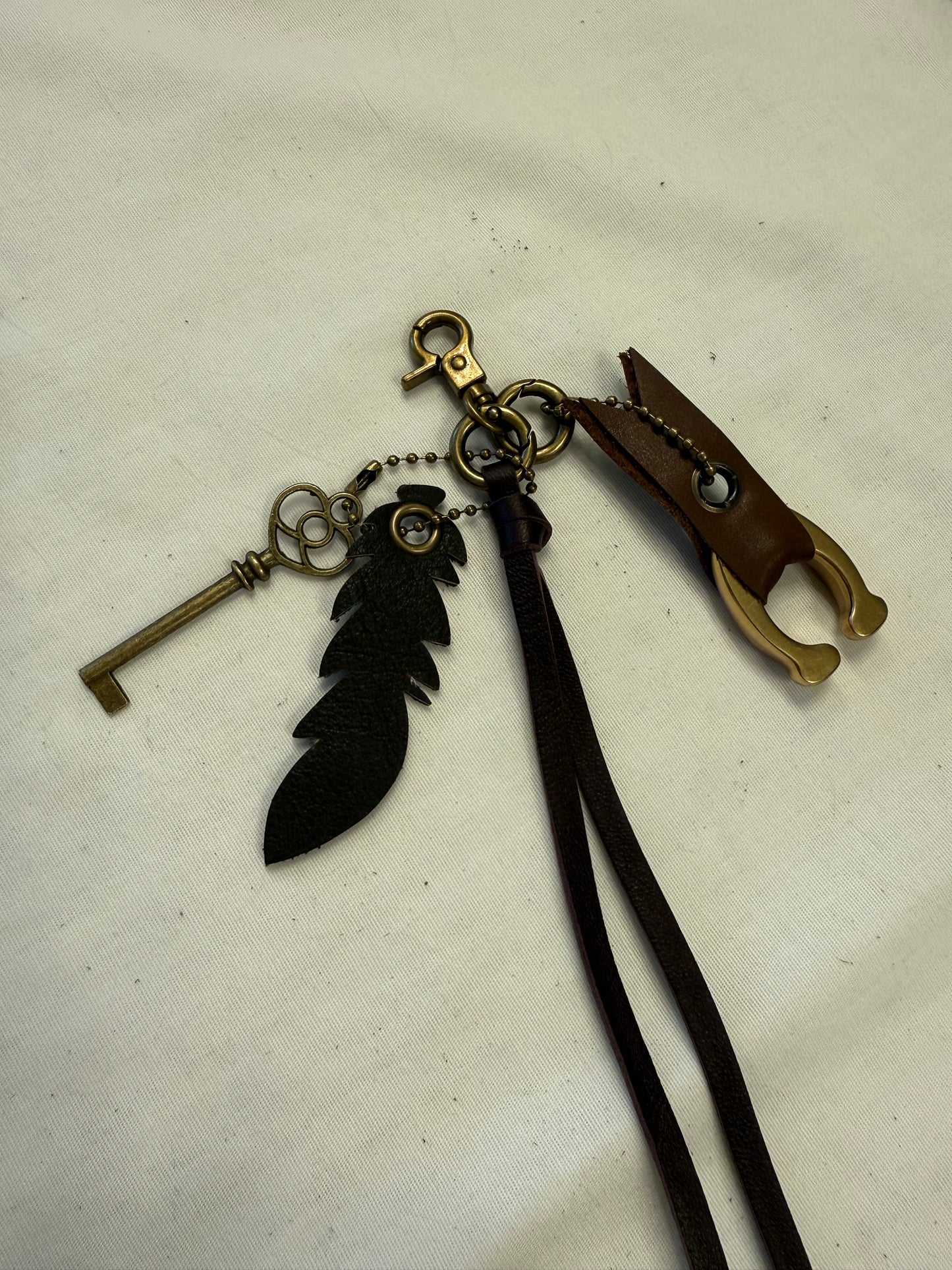 Upcrafted Bag Charm Cluster | Repurposed Coach Leather Tassel, Tic Tac Toe "C", Key & Leather Feather