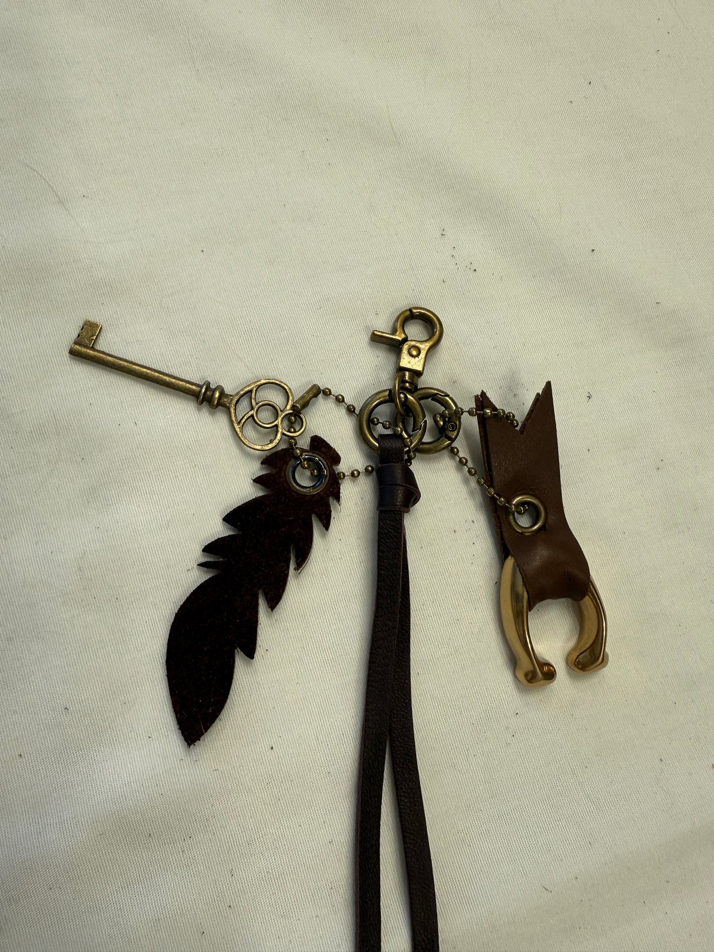 Upcrafted Bag Charm Cluster | Repurposed Coach Leather Tassel, Tic Tac Toe "C", Key & Leather Feather