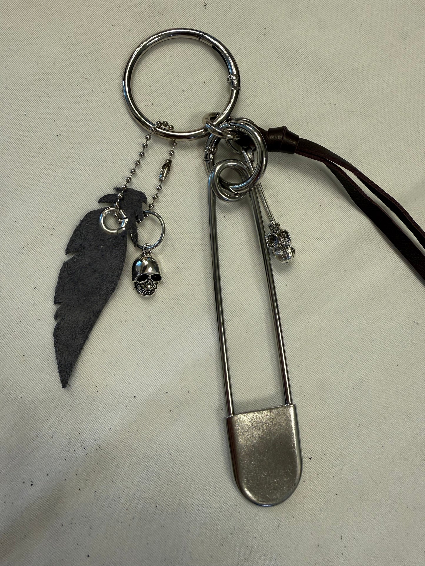 Bag Charm Cluster | Repurposed Coach Oxblood Leather Tie/Tassel, Dusty Blue Leather Feather & Skull Charms