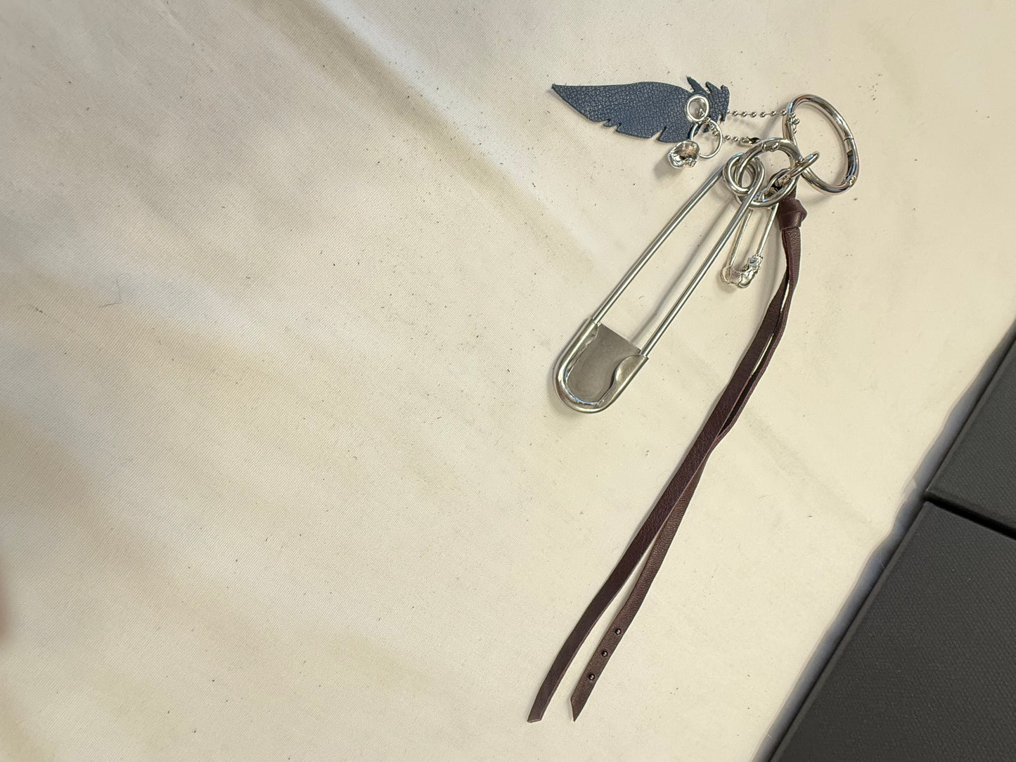 Bag Charm Cluster | Repurposed Coach Oxblood Leather Tie/Tassel, Dusty Blue Leather Feather & Skull Charms
