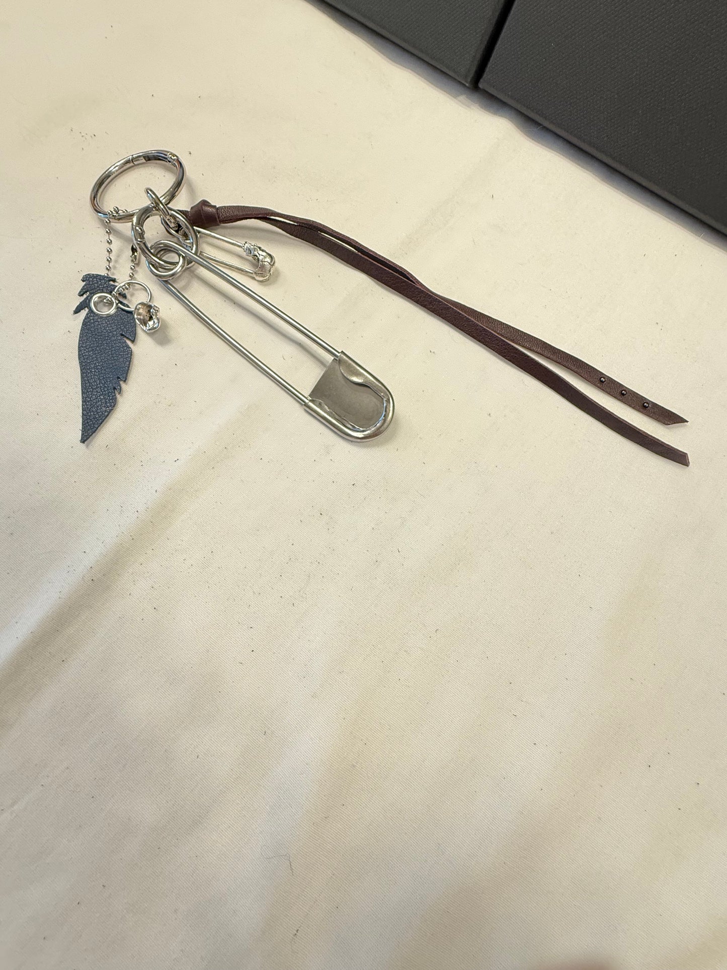 Bag Charm Cluster | Repurposed Coach Oxblood Leather Tie/Tassel, Dusty Blue Leather Feather & Skull Charms