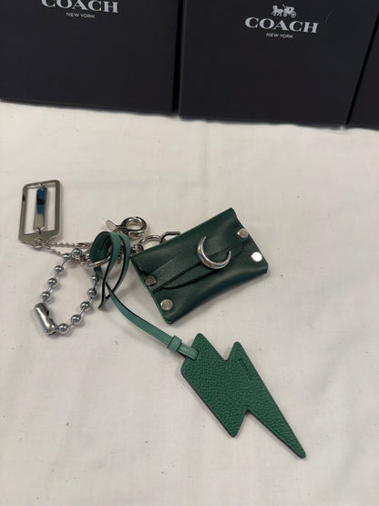 One-of-a-Kind Upcrafted Coach Bag Charm Cluster | Re(Loved) Lightning Bolt, Card Pouch & Silver Coach Hangtag