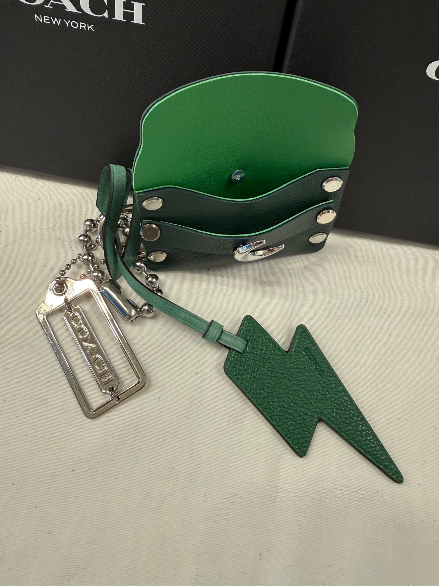 One-of-a-Kind Upcrafted Coach Bag Charm Cluster | Re(Loved) Lightning Bolt, Card Pouch & Silver Coach Hangtag