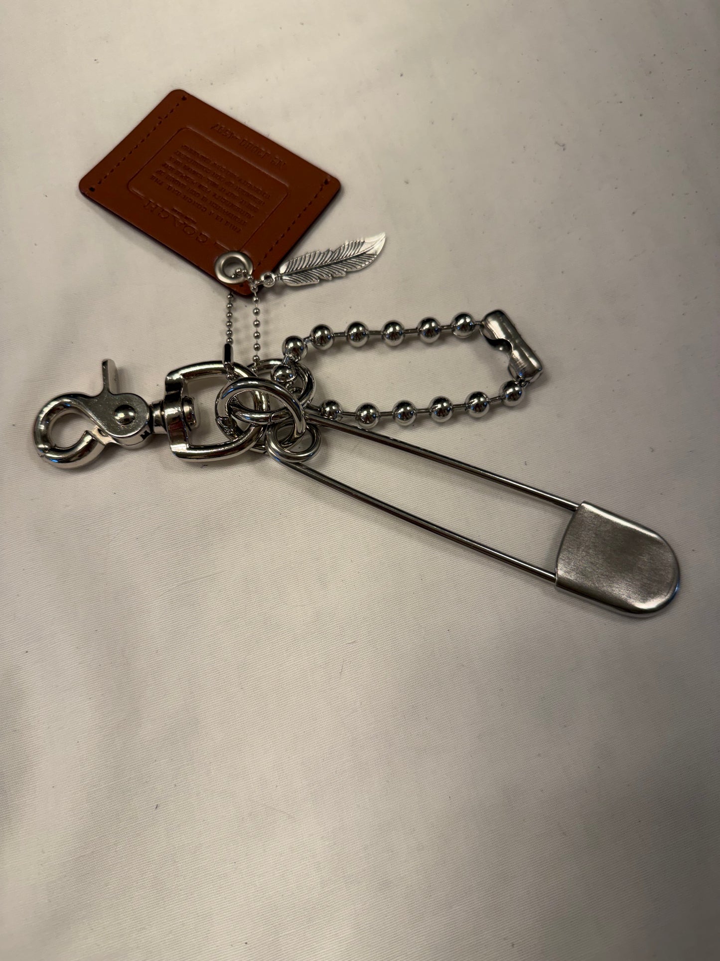 Upcrafted Coach Storypatch Bag Charm Cluster – Repurposed Coach Creed Patch – XL Silver Tone Safety Pin – Feather Charm – One of a Kind