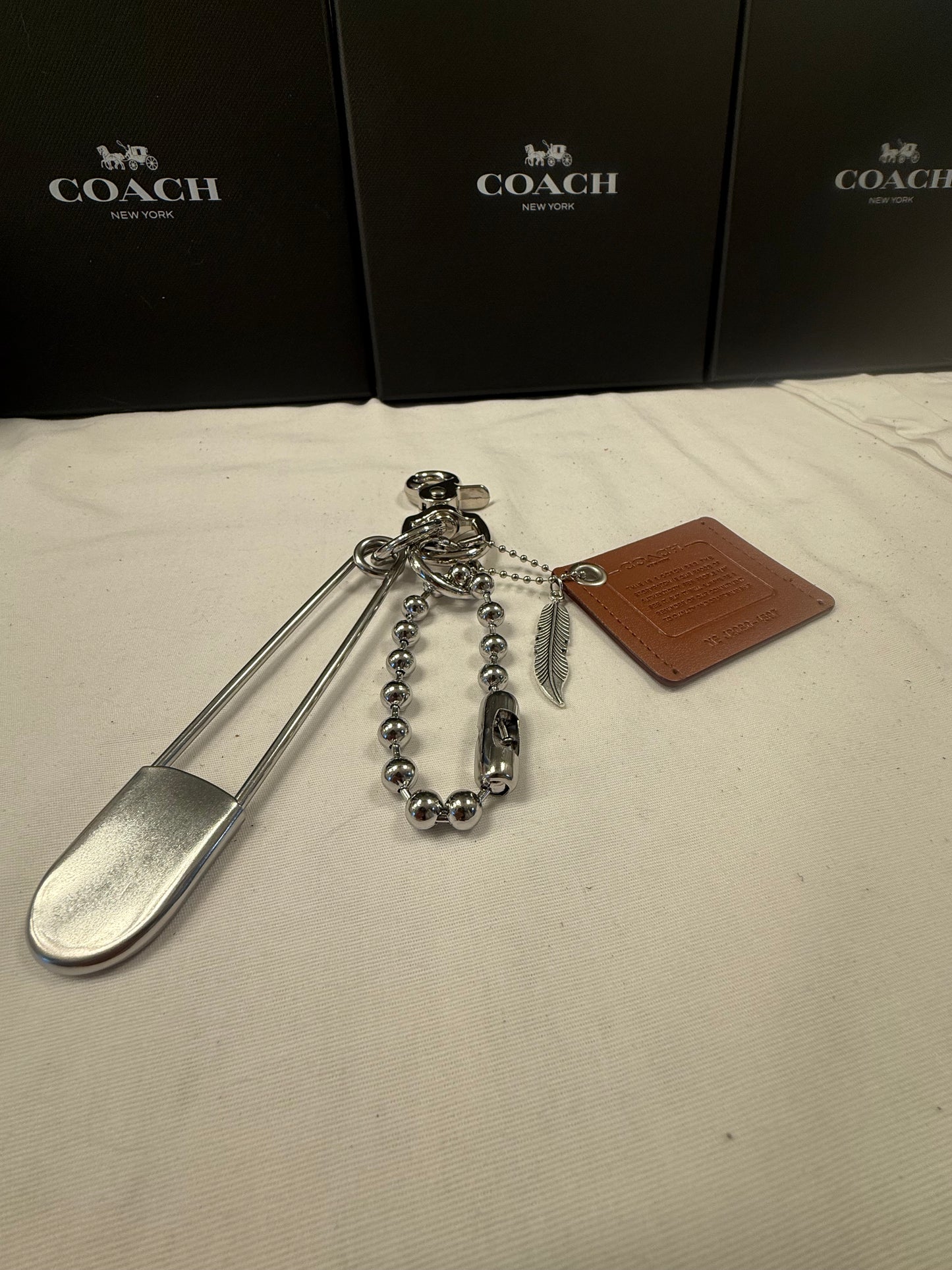 Upcrafted Coach Storypatch Bag Charm Cluster – Repurposed Coach Creed Patch – XL Silver Tone Safety Pin – Feather Charm – One of a Kind