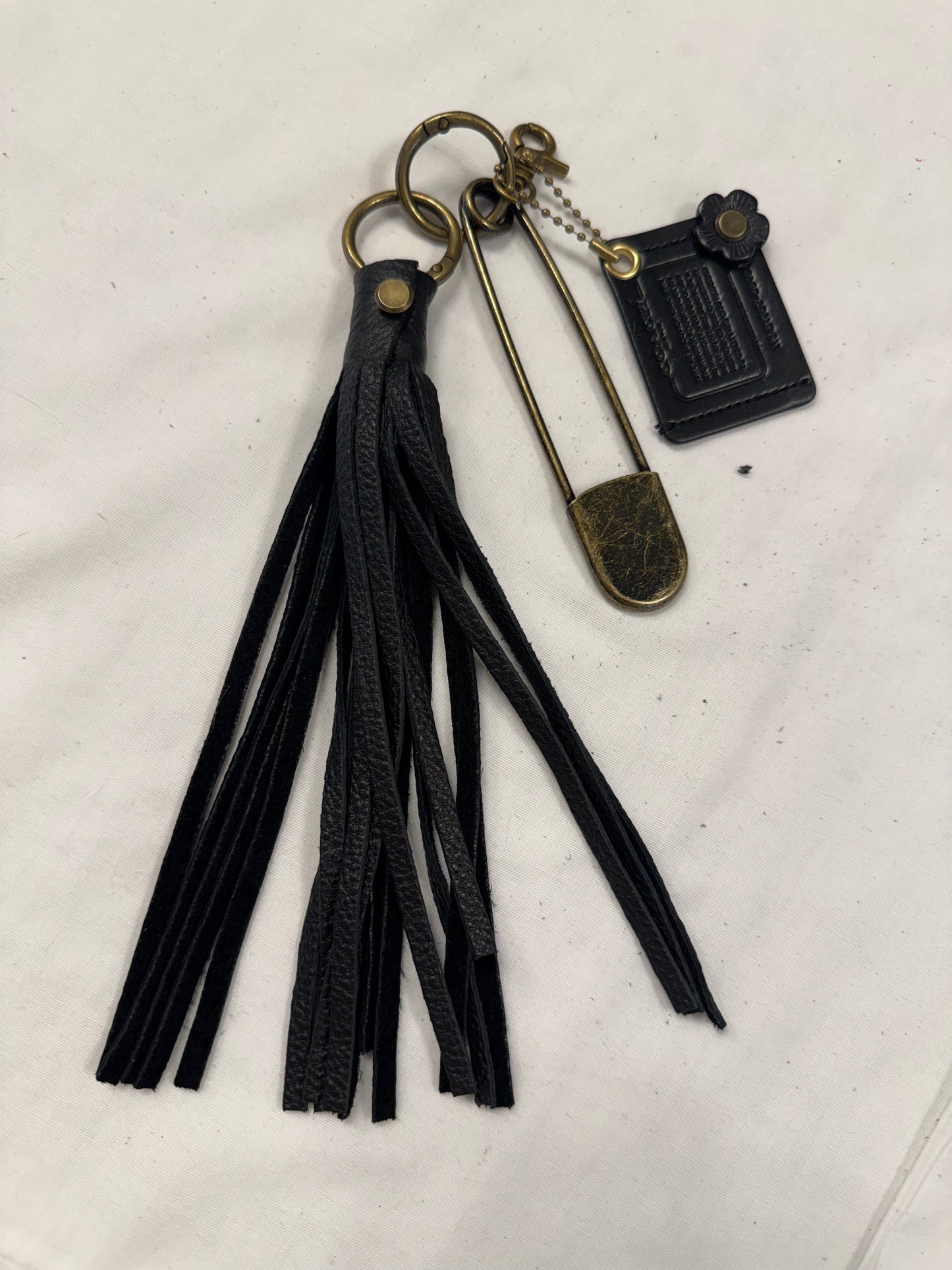 Upcrafted Coach Storypatch & Tea Rose Bag Charm – Repurposed Coach Creed Patch – Black Leather Tassel – Antique Brass Hardware – One of a Kind