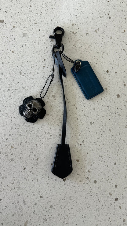 Coach Repurposed Leather Tea Roses with Skull Pin, Coach Clochette, and Painted Coach Hangtag with Black Skull Charm Bag Cluster