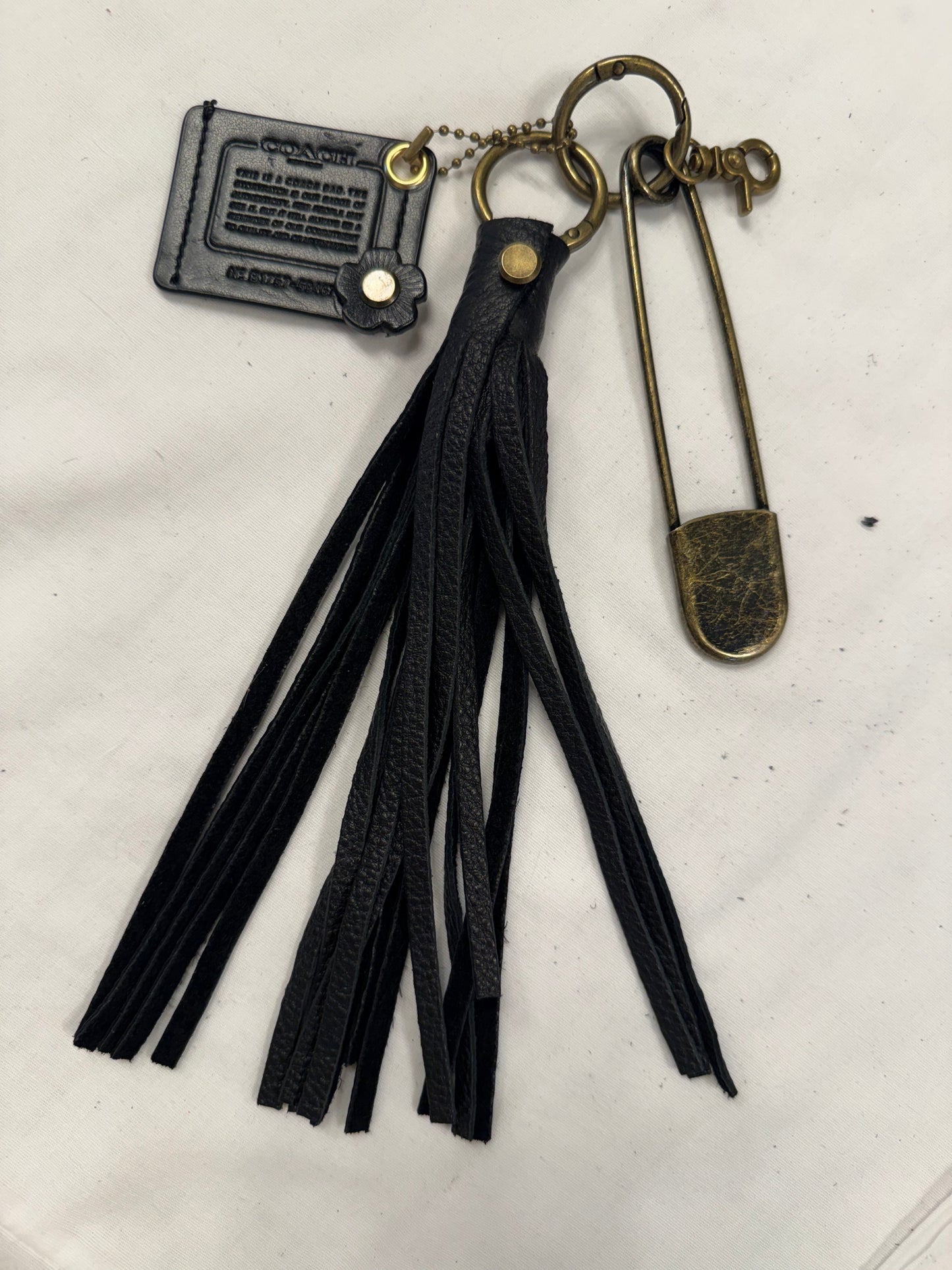 Upcrafted Coach Storypatch & Tea Rose Bag Charm – Repurposed Coach Creed Patch – Black Leather Tassel – Antique Brass Hardware – One of a Kind