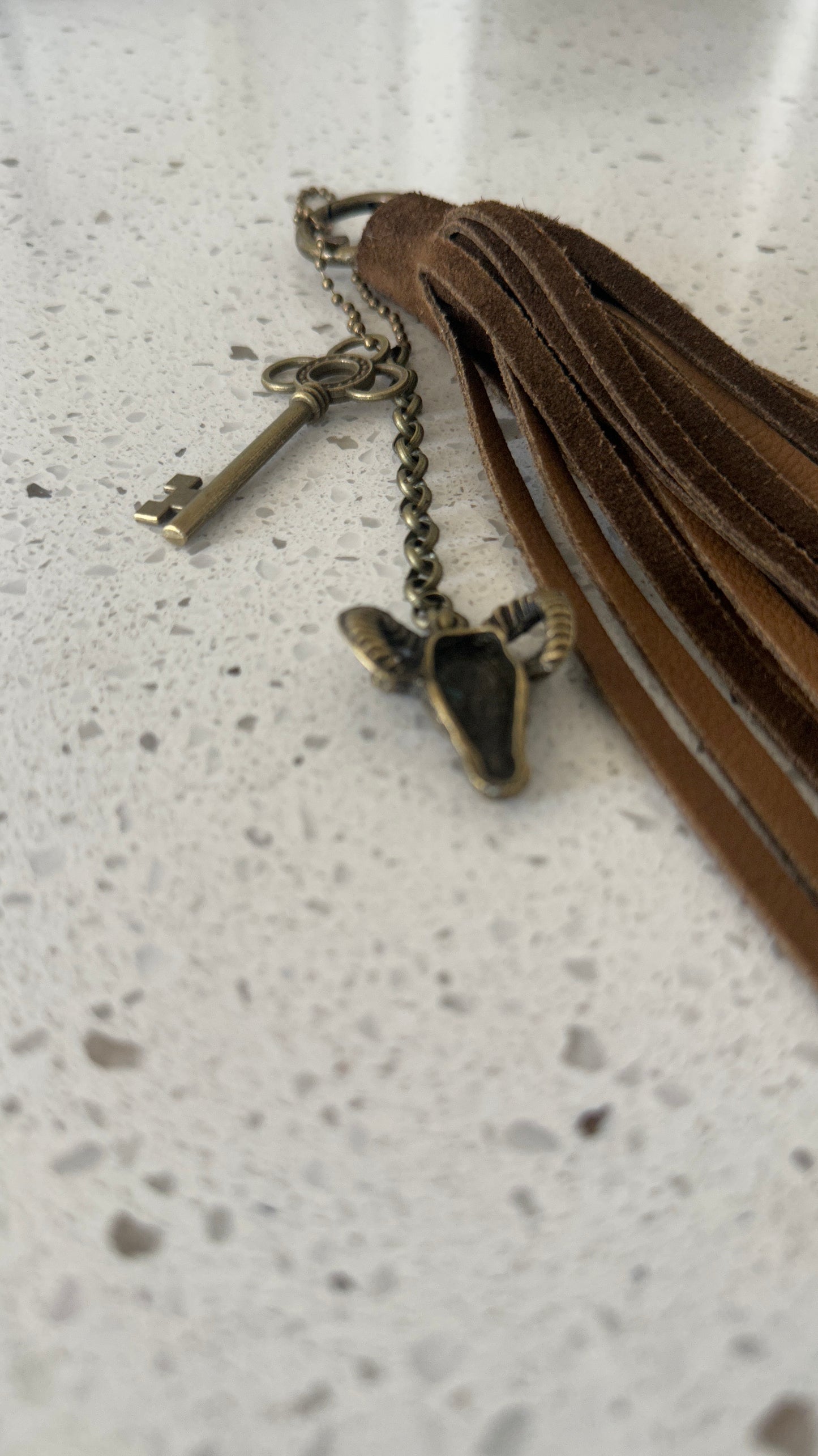 Bag Charm Cluster with Brown Sueded Tassel and Key and Ram Head Charm Antique Brass Hardware