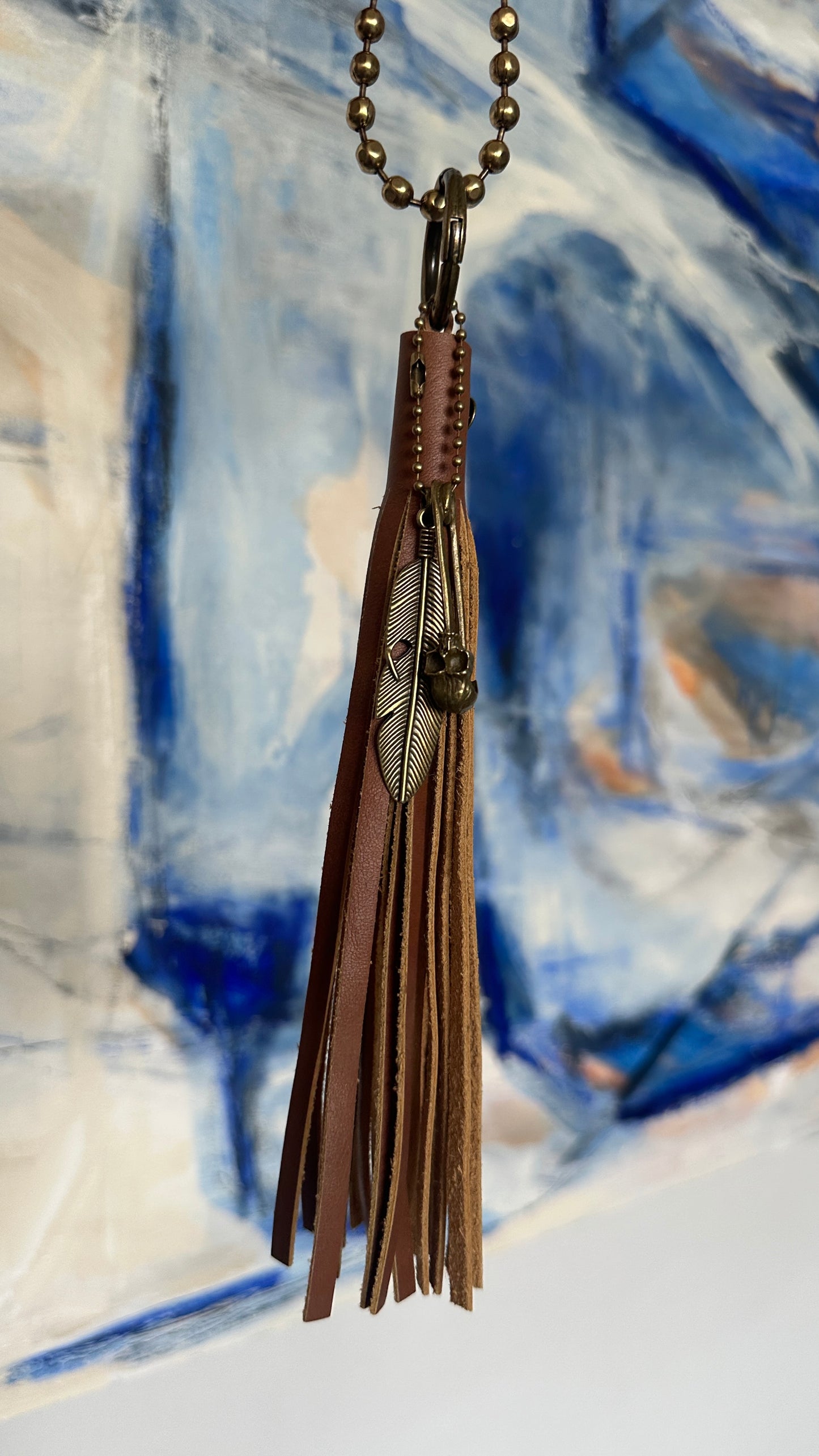 Bag Charm Cluster in Antique Brass with a Handmade Brown Leather Tassel, Coach Large Ball Chain, and Feather with Skull Safety Pin Charm