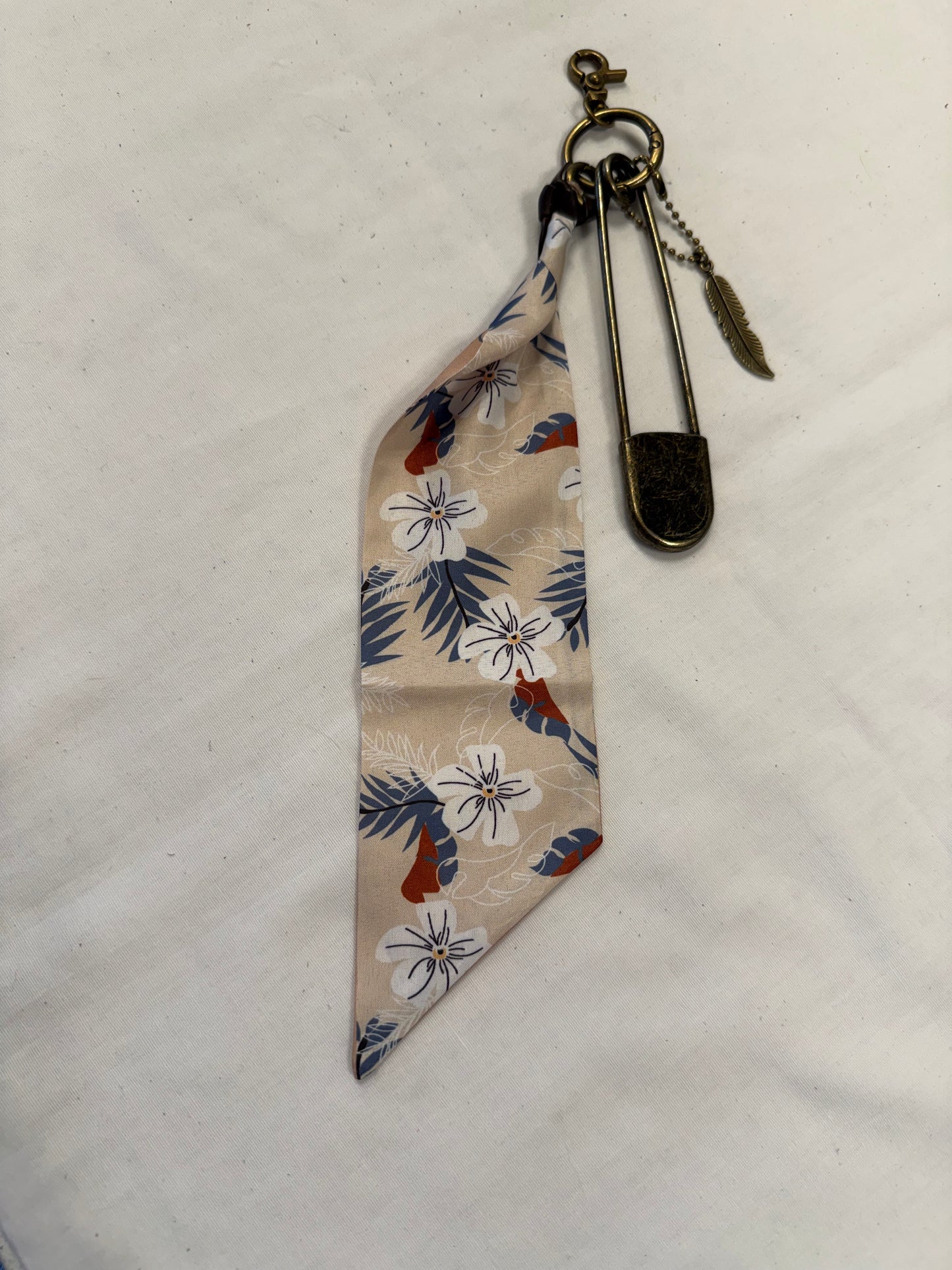 Tan & Blue Floral Scarf, Safety Pin, and Feather Bag Charm Cluster on Antique Brass Tone Hardware