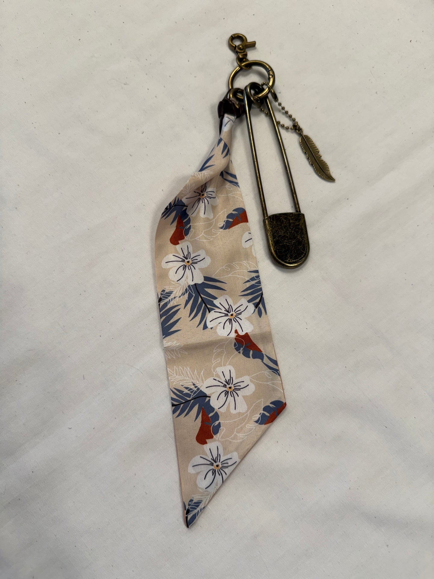 Tan & Blue Floral Scarf, Safety Pin, and Feather Bag Charm Cluster on Antique Brass Tone Hardware