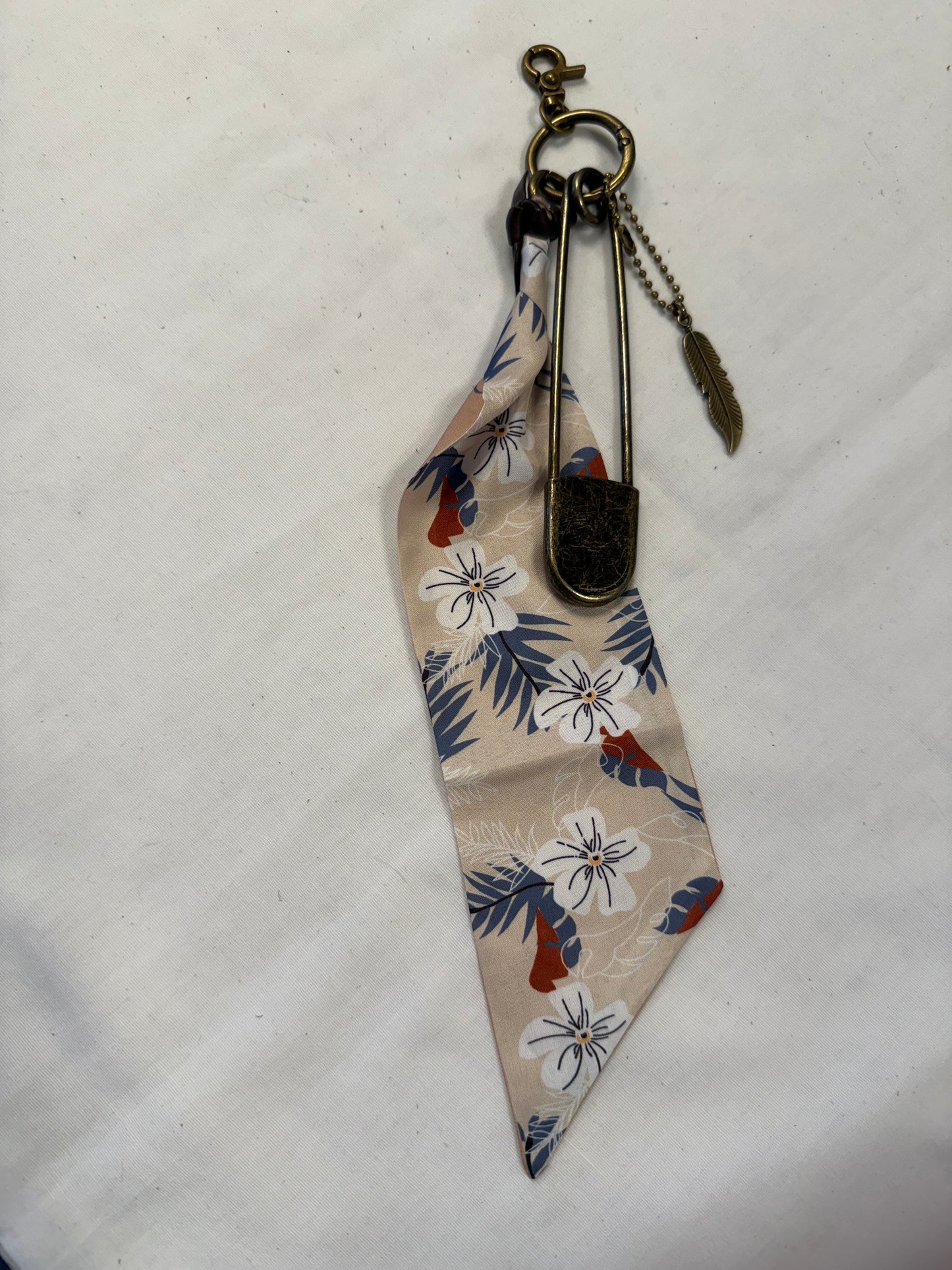 Tan & Blue Floral Scarf, Safety Pin, and Feather Bag Charm Cluster on Antique Brass Tone Hardware