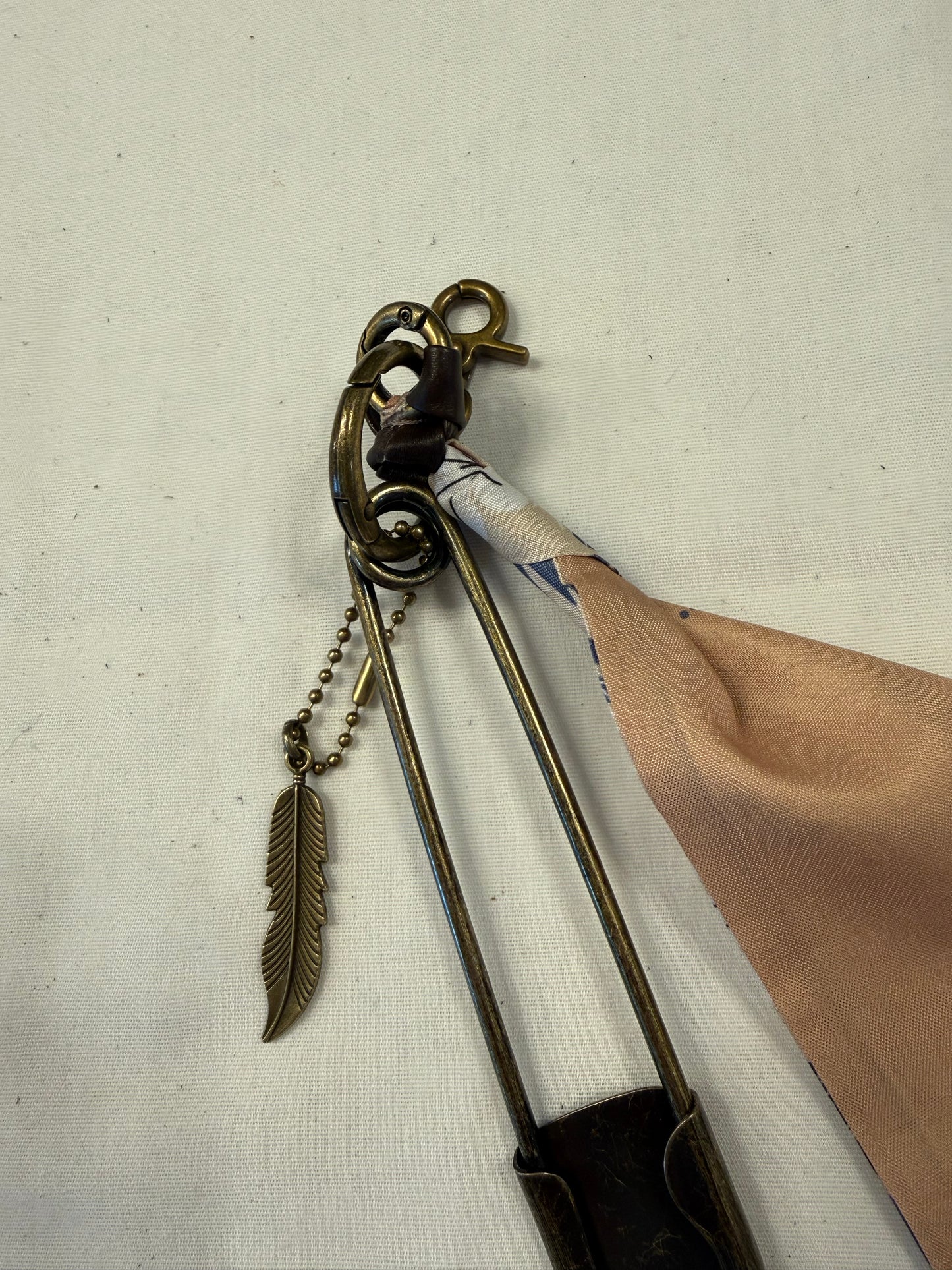 Tan & Blue Floral Scarf, Safety Pin, and Feather Bag Charm Cluster on Antique Brass Tone Hardware