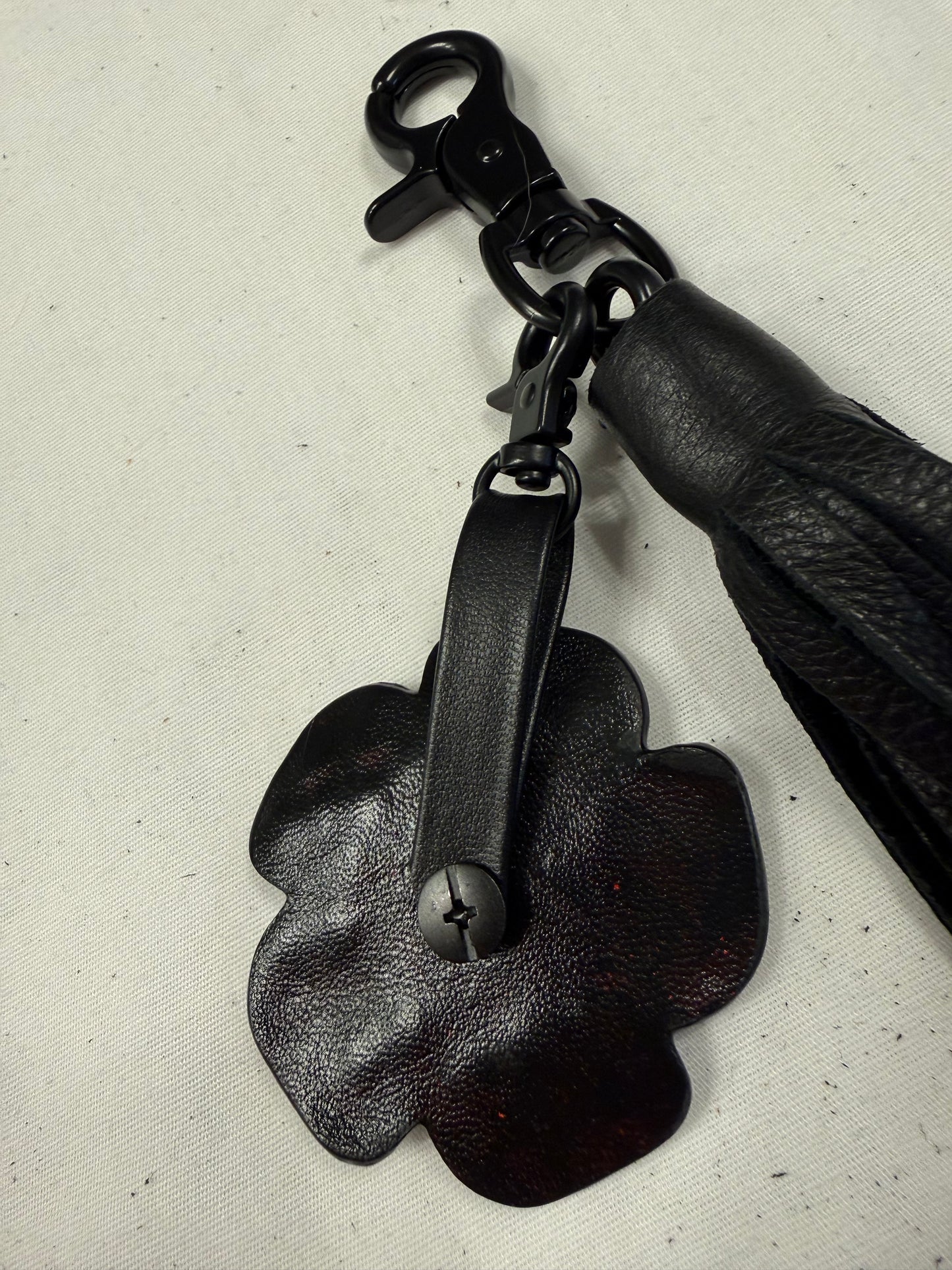 Black Pebbled Leather Tassel with Repurposed Coach Tea Rose