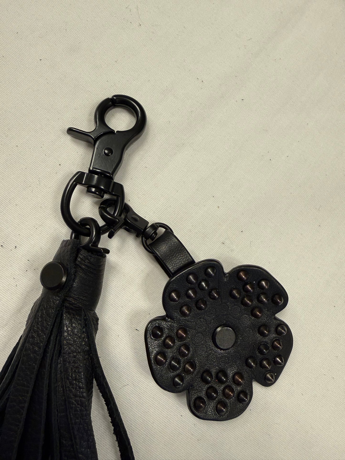 Black Pebbled Leather Tassel with Repurposed Coach Tea Rose