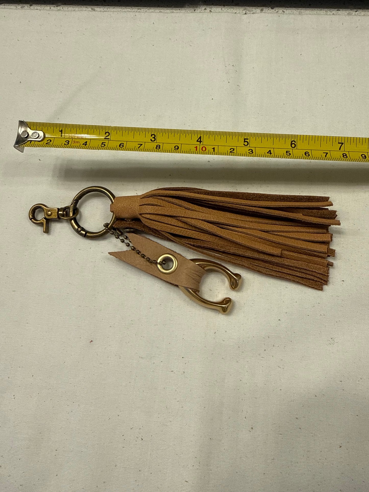 Tan Leather Tassel & Repurposed Coach “C” Bag Charm Cluster