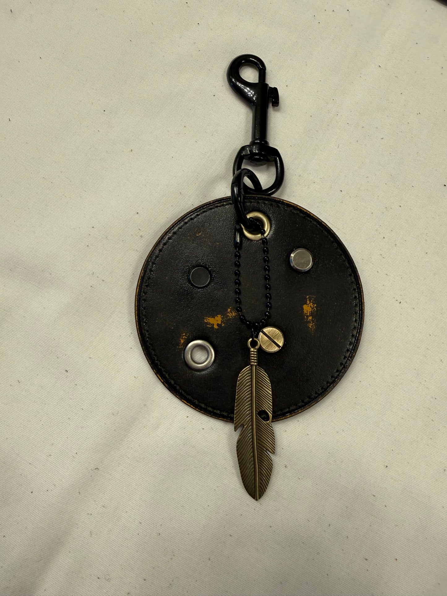 Repurposed Coach Coaster Bag Charm with Rivets and Feather