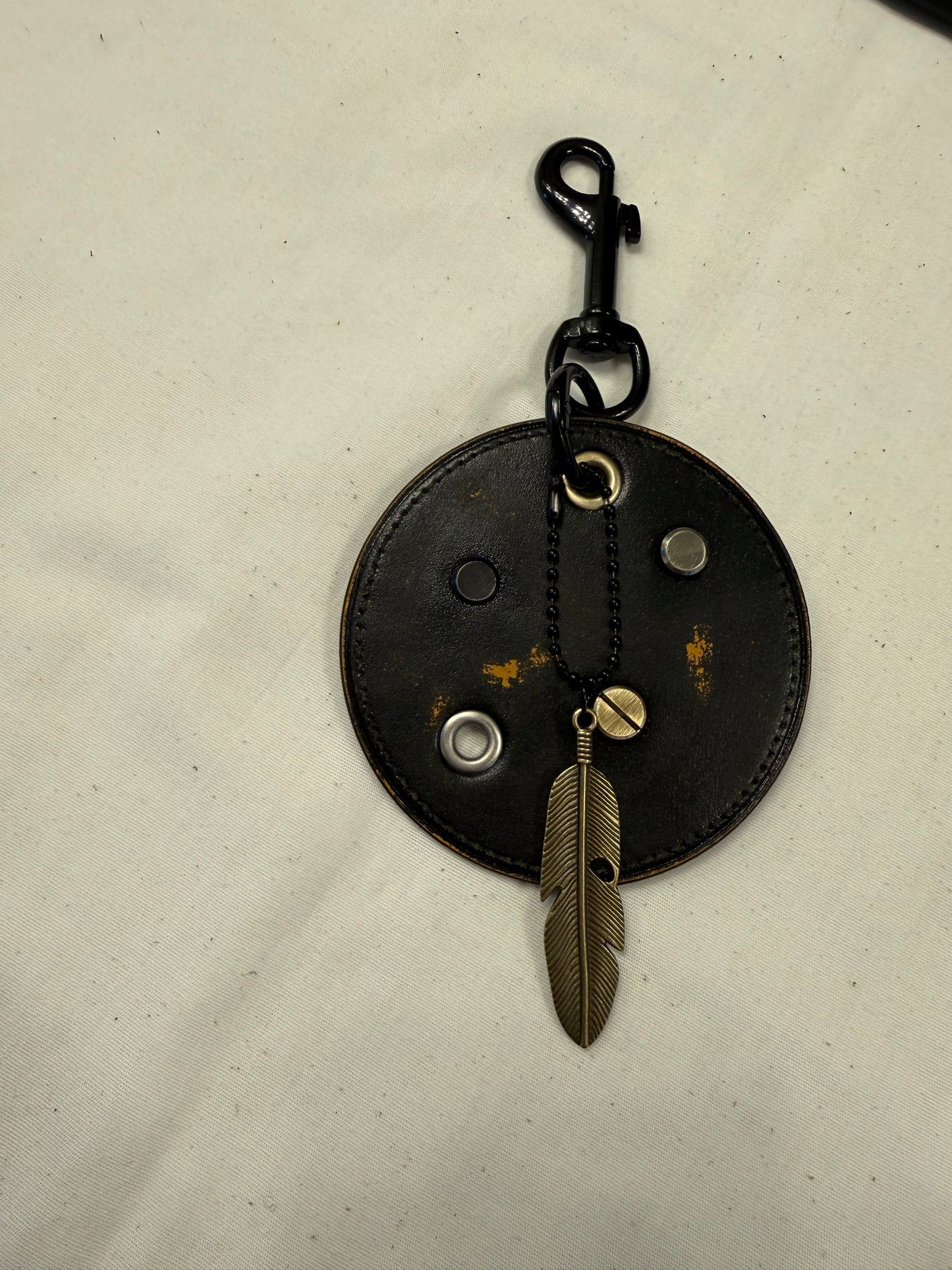 Repurposed Coach Coaster Bag Charm with Rivets and Feather