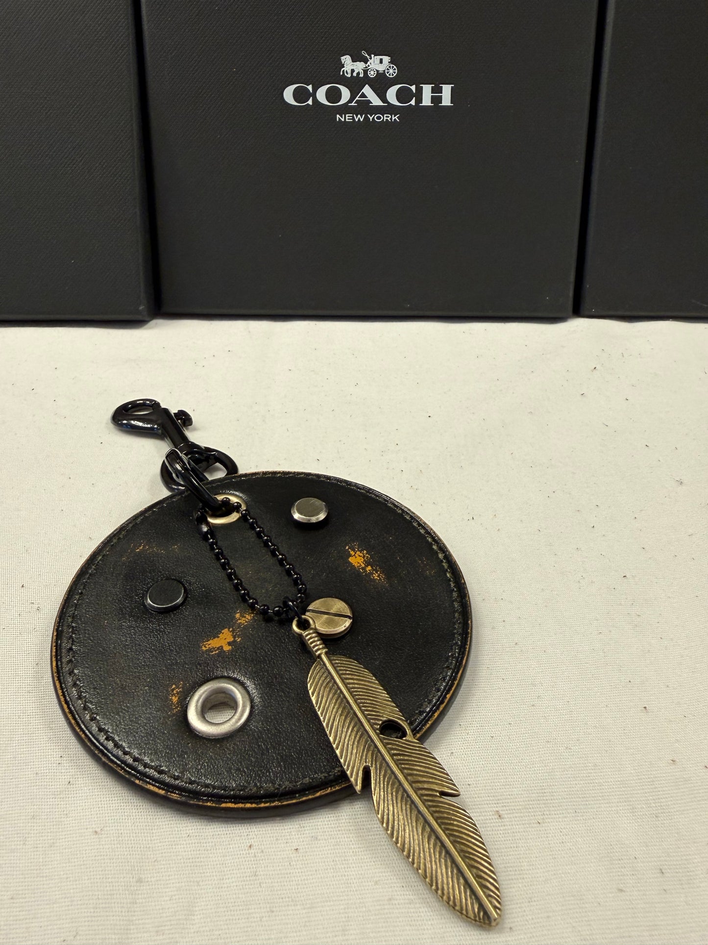 Repurposed Coach Coaster Bag Charm with Rivets and Feather