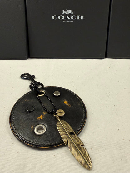 Repurposed Coach Coaster Bag Charm with Rivets and Feather