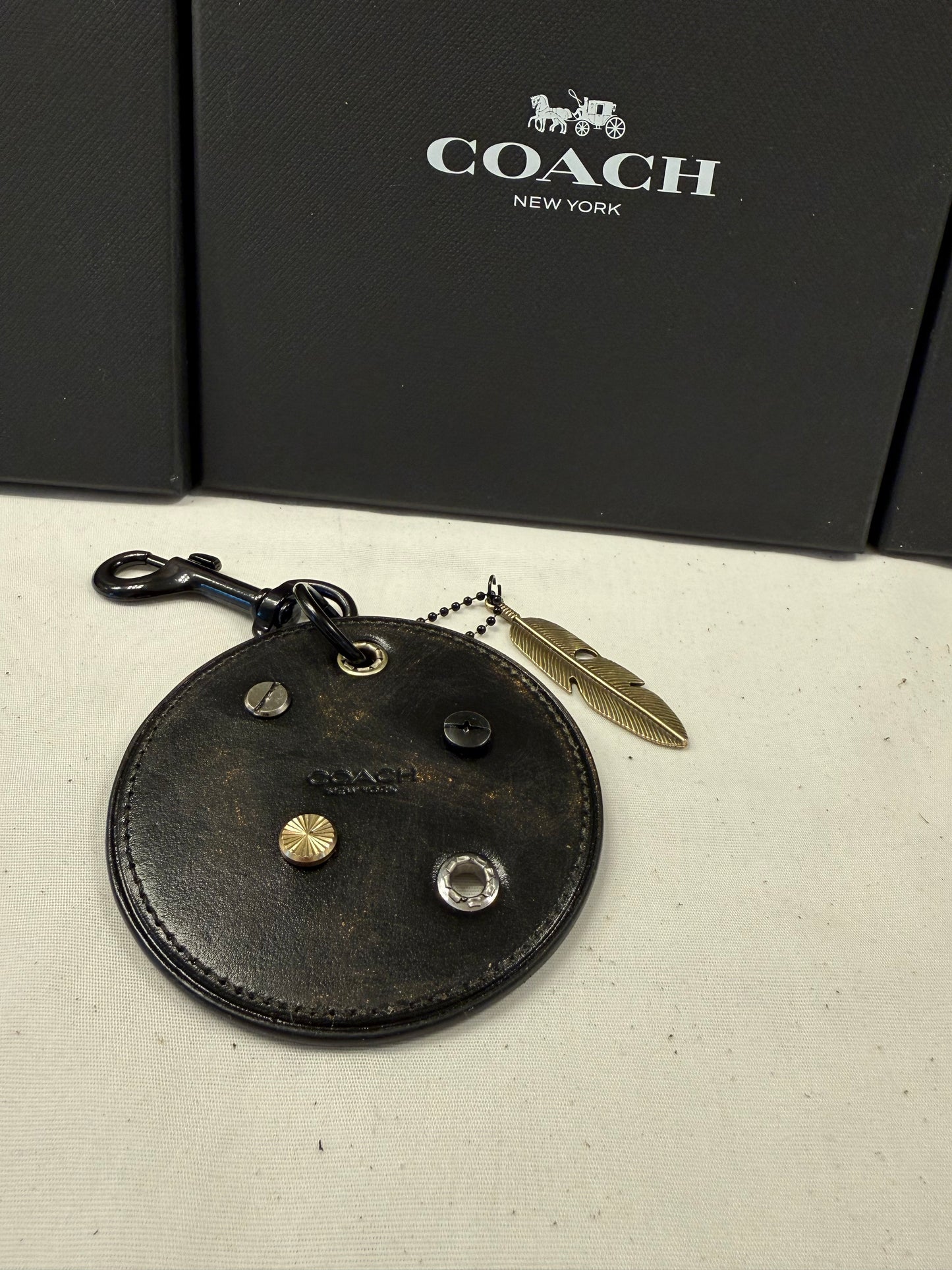 Repurposed Coach Coaster Bag Charm with Rivets and Feather
