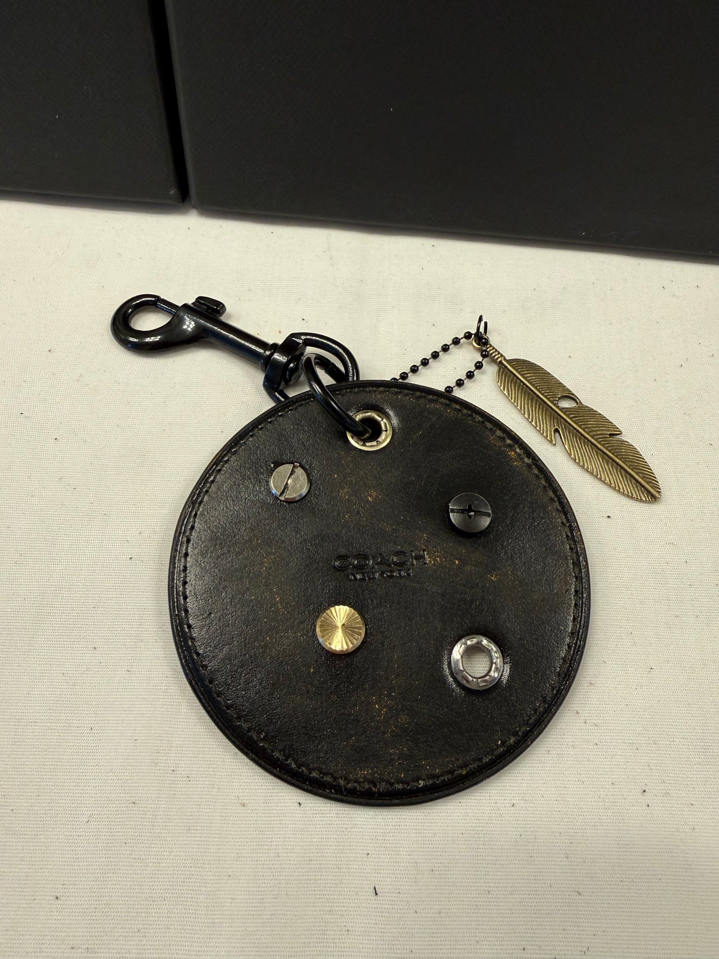 Repurposed Coach Coaster Bag Charm with Rivets and Feather