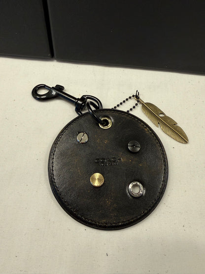 Repurposed Coach Coaster Bag Charm with Rivets and Feather