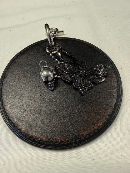 Repurposed Coach Coaster Bag Charm with Skull and Moth Charms