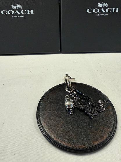 Repurposed Coach Coaster Bag Charm with Skull and Moth Charms