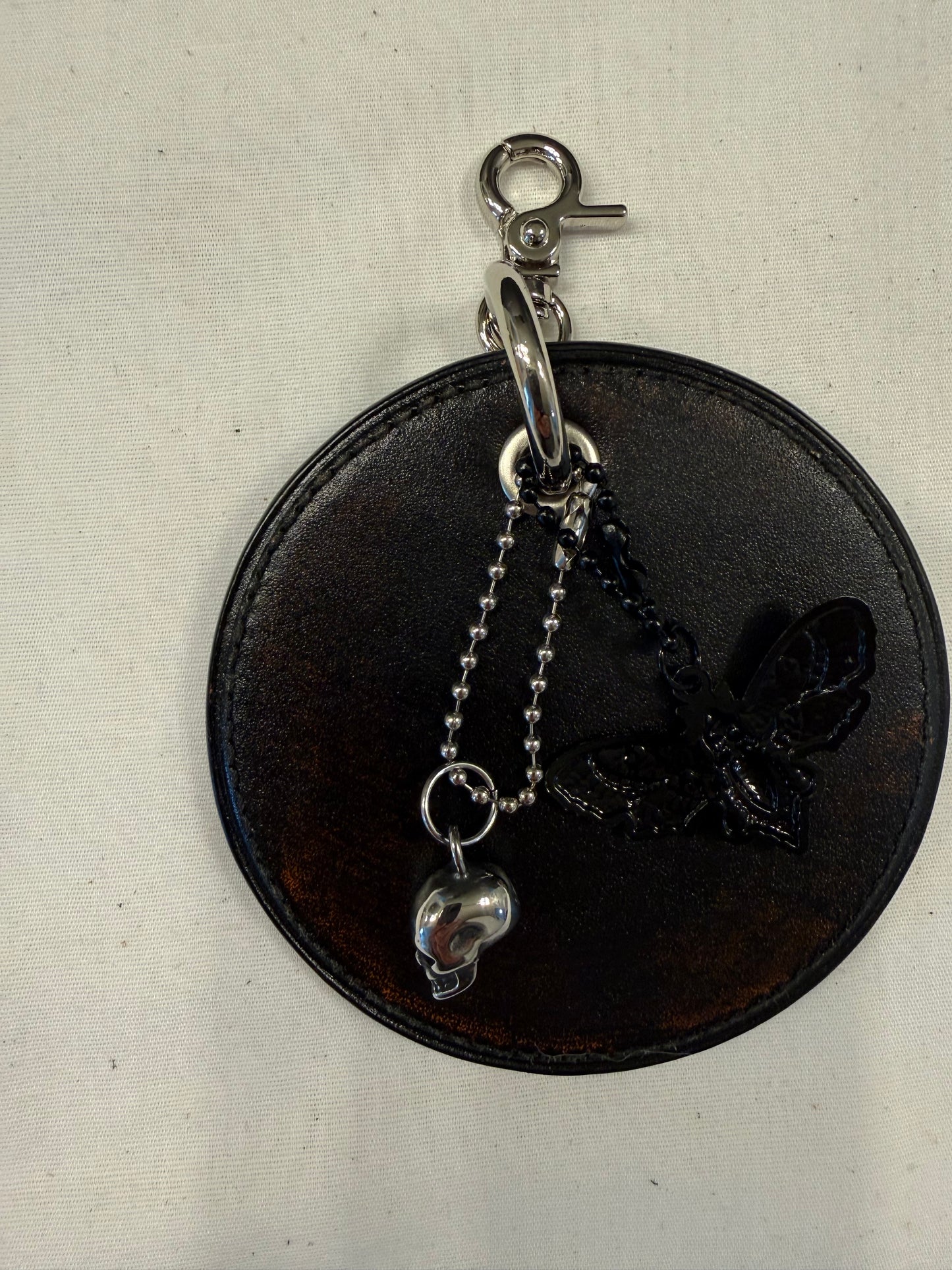Repurposed Coach Coaster Bag Charm with Skull and Moth Charms