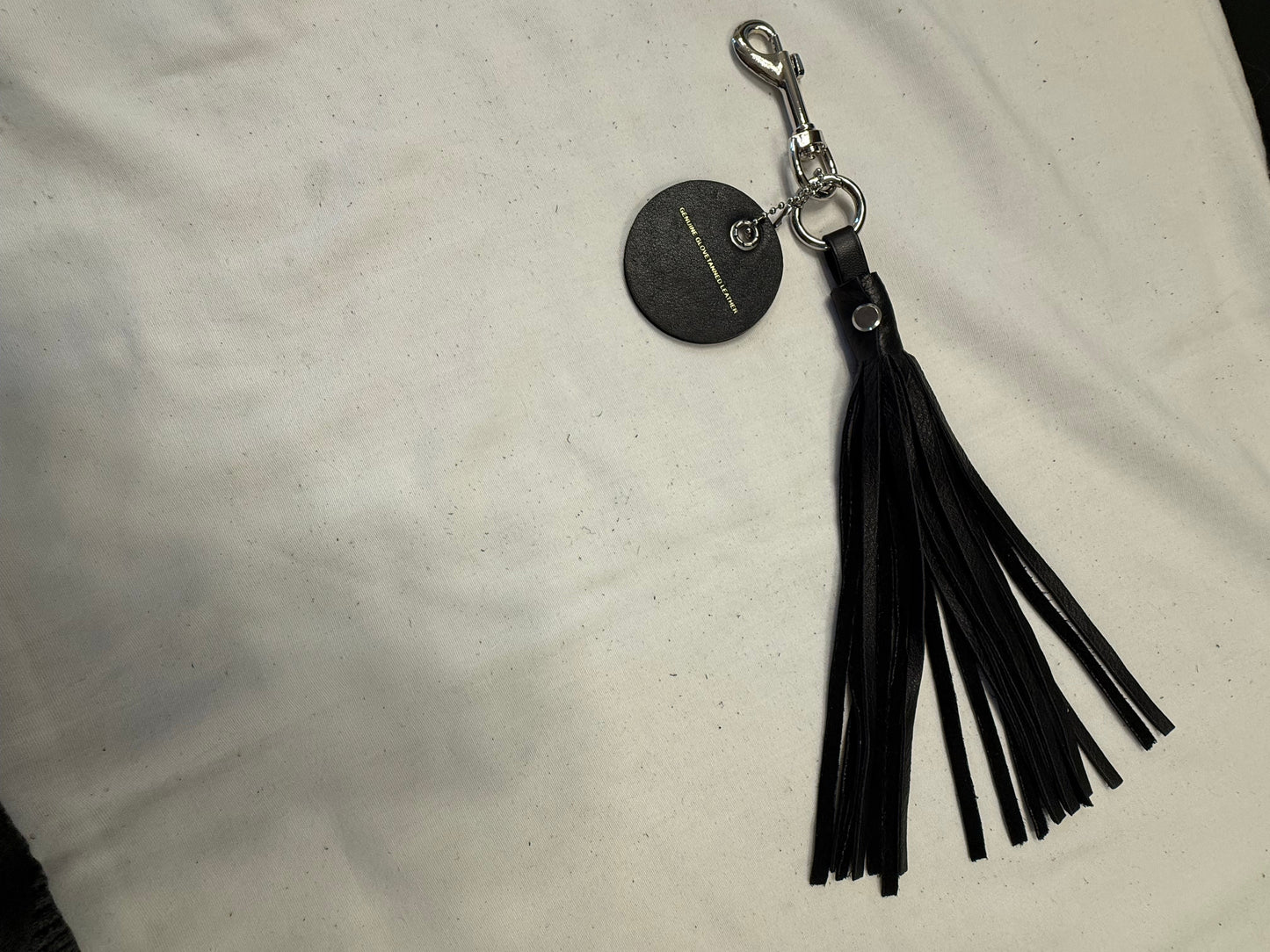 Handmade Pebbled Leather Tassel & Repurposed Coach Charm