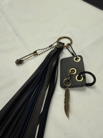 Vegan Leather Handmade Tassel with Repurposed Coach Tic Tac Toe Piece Riveted Charm and Skull Safety Pin Antique Brass Bag Charm