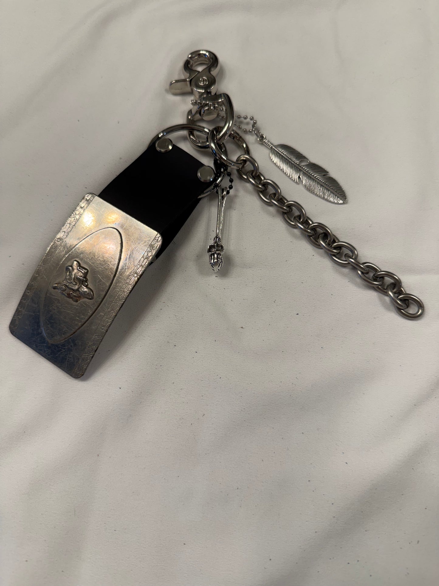 Repurposed Silver Buckle with Saddle Bag Charm Cluster with Feather and Chain