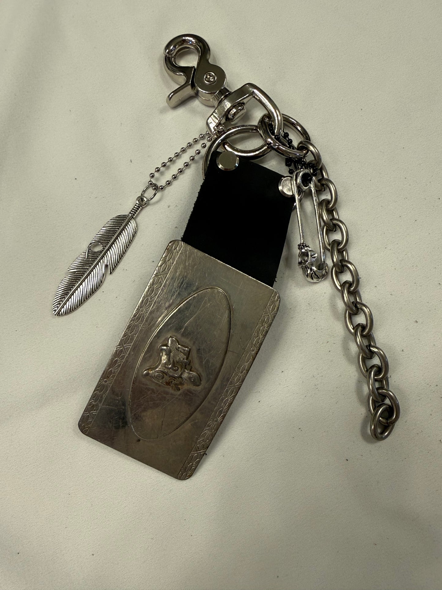 Repurposed Silver Buckle with Saddle Bag Charm Cluster with Feather and Chain