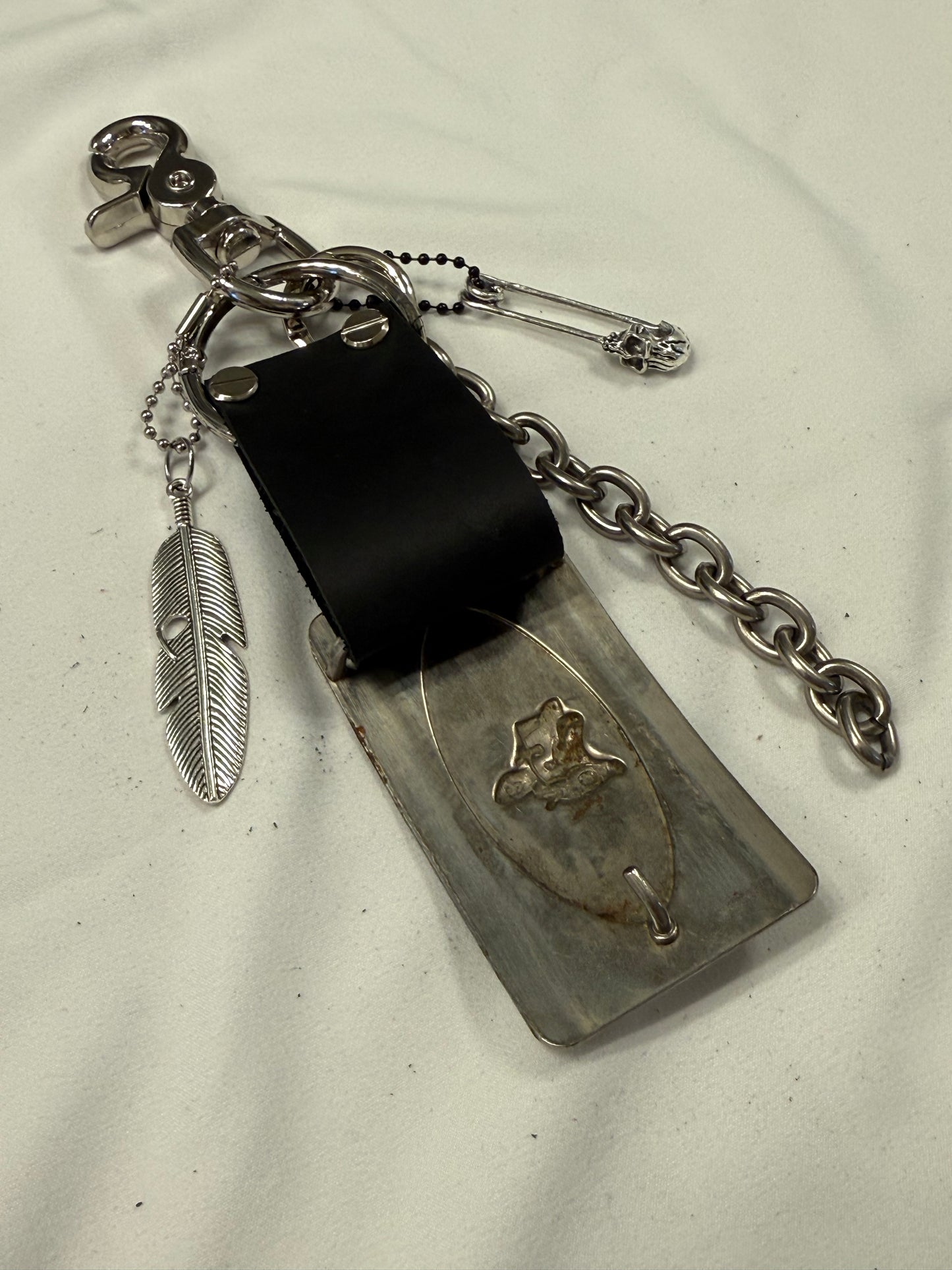 Repurposed Silver Buckle with Saddle Bag Charm Cluster with Feather and Chain