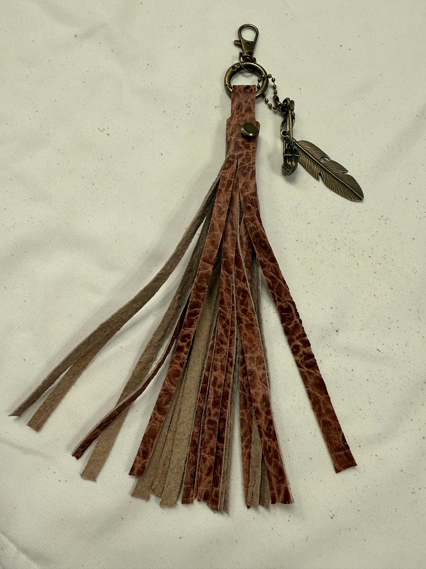 Hand cut Leather Brown Embossed Tassel with Skull Safety Pin and Feather Charm