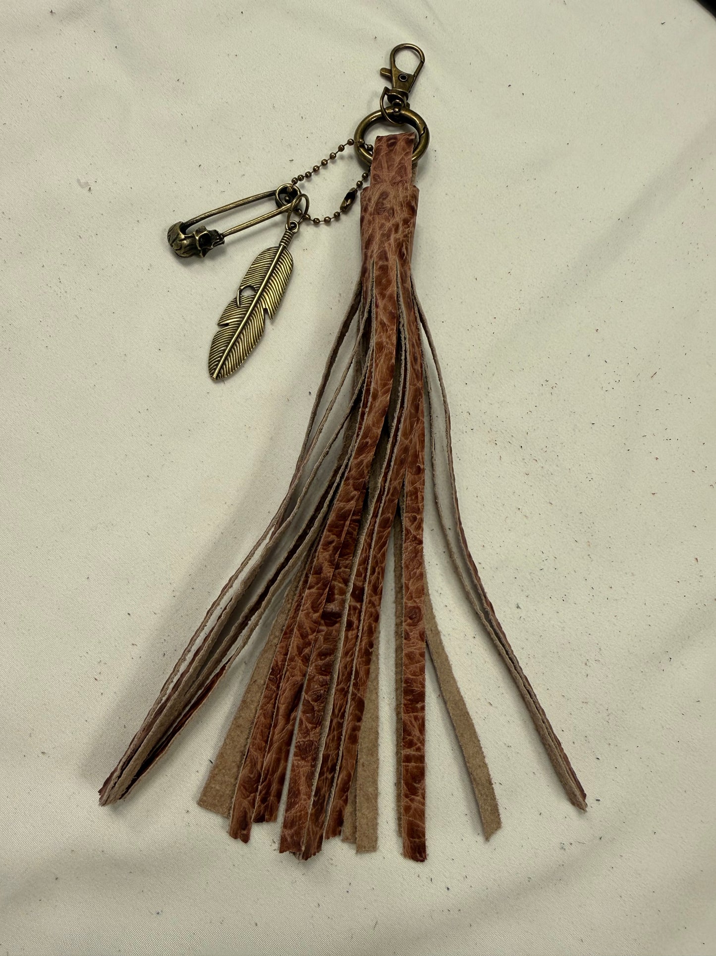 Hand cut Leather Brown Embossed Tassel with Skull Safety Pin and Feather Charm