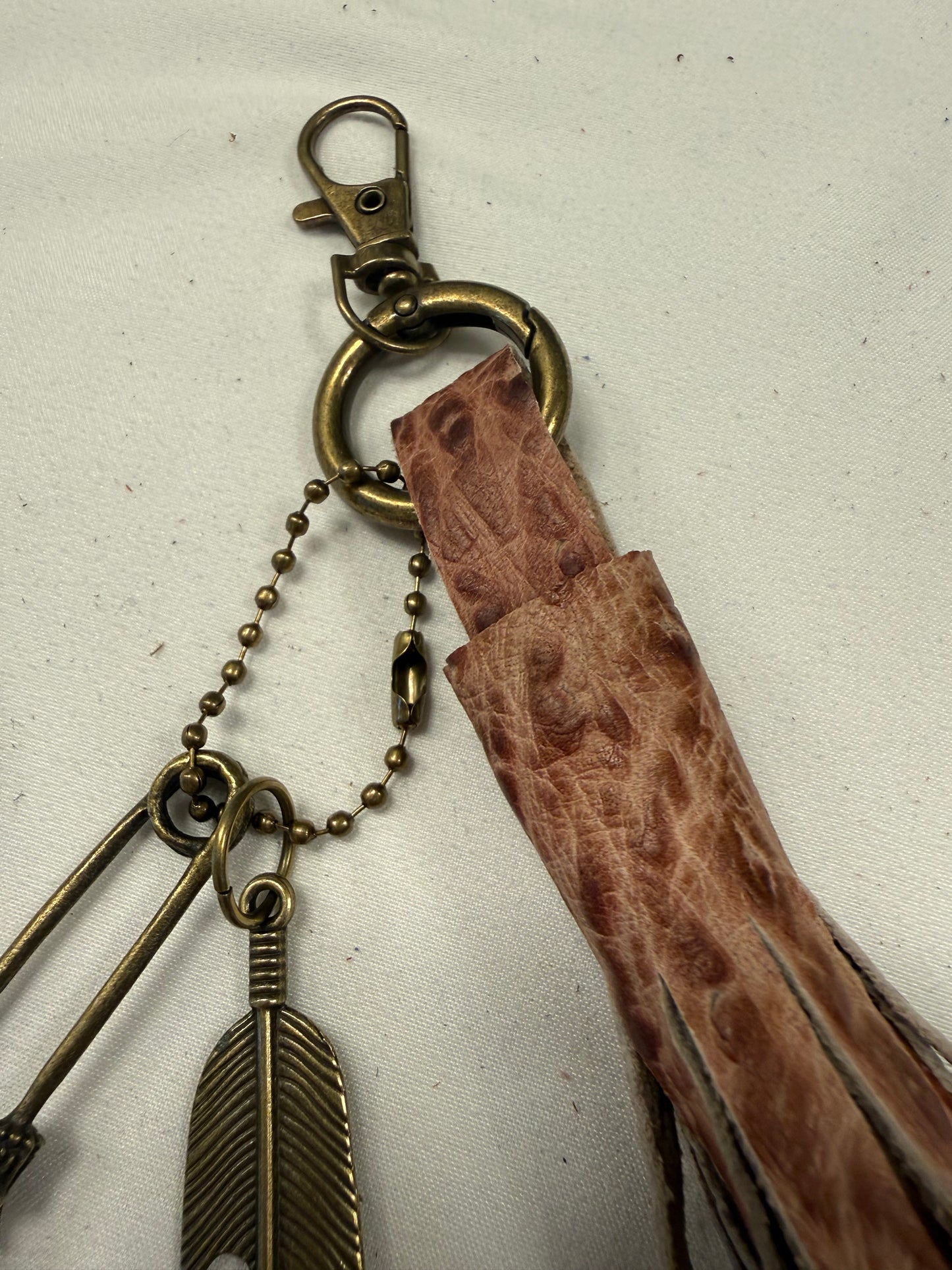Hand cut Leather Brown Embossed Tassel with Skull Safety Pin and Feather Charm