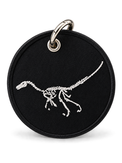 Dinosaur Skeleton Patch on a Piece of Repurposed Coach Handbag Bag Charm