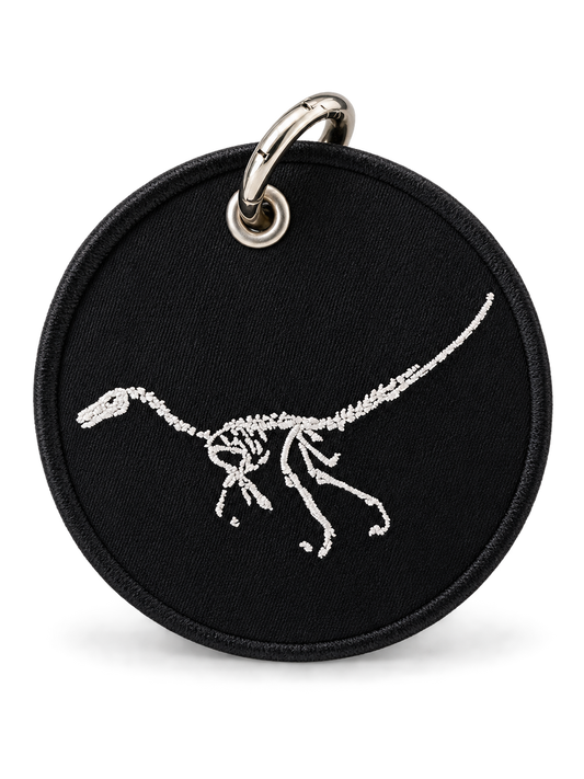 Dinosaur Skeleton Patch on a Piece of Repurposed Coach Handbag Bag Charm